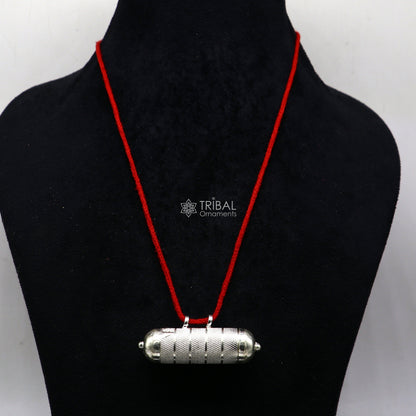 Sterling silver vintage round amulet box pendant with tribal tribal ornament design, featuring mantra box and kavacham style jewelry.