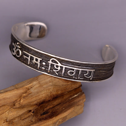 Vintage tribal-style 925 sterling silver "Aum Namah Shivay" mantra unisex bangle cuff bracelet with adjustable design.