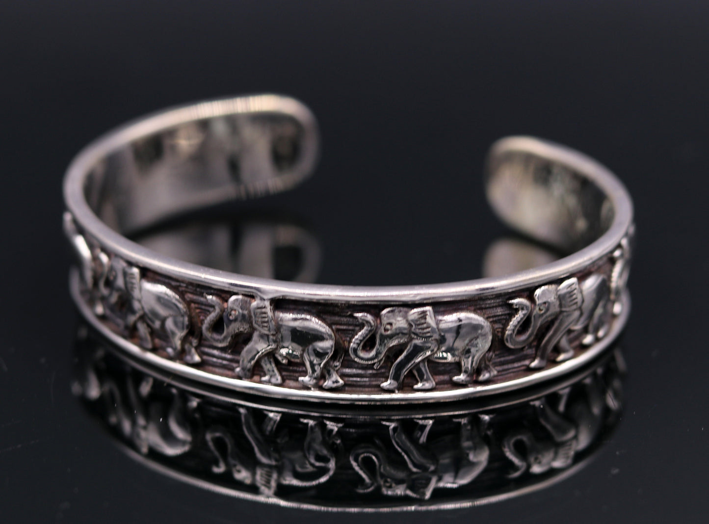 Sterling silver elephant design adjustable bangle cuff bracelet by Tribal Ornaments, unisex Indian jewelry with vintage antique details.