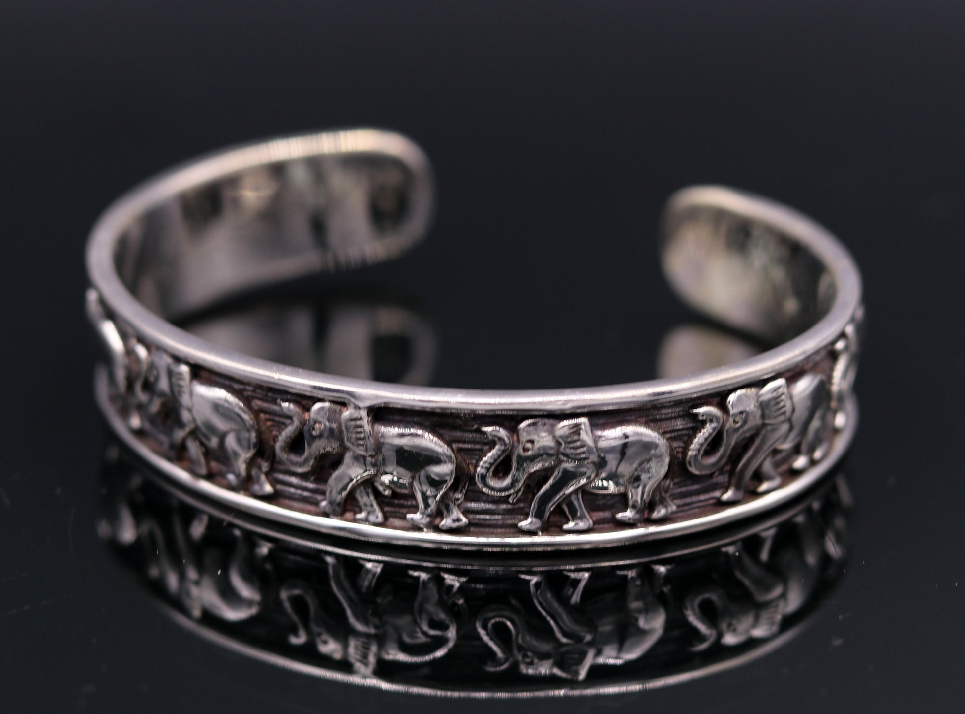 Sterling silver elephant design adjustable bangle cuff bracelet by Tribal Ornaments, unisex Indian jewelry with vintage antique details.