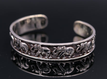 Sterling silver elephant design adjustable bangle cuff bracelet by Tribal Ornaments, unisex Indian jewelry with vintage antique details.