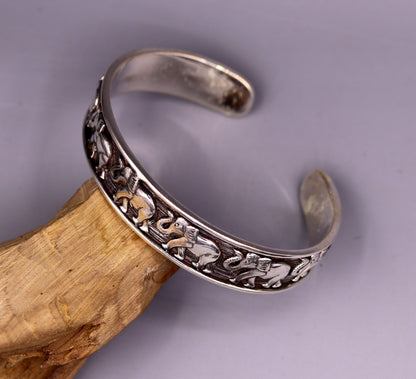 Sterling silver elephant design adjustable bangle cuff bracelet by Tribal Ornaments, unisex Indian jewelry with vintage antique style.