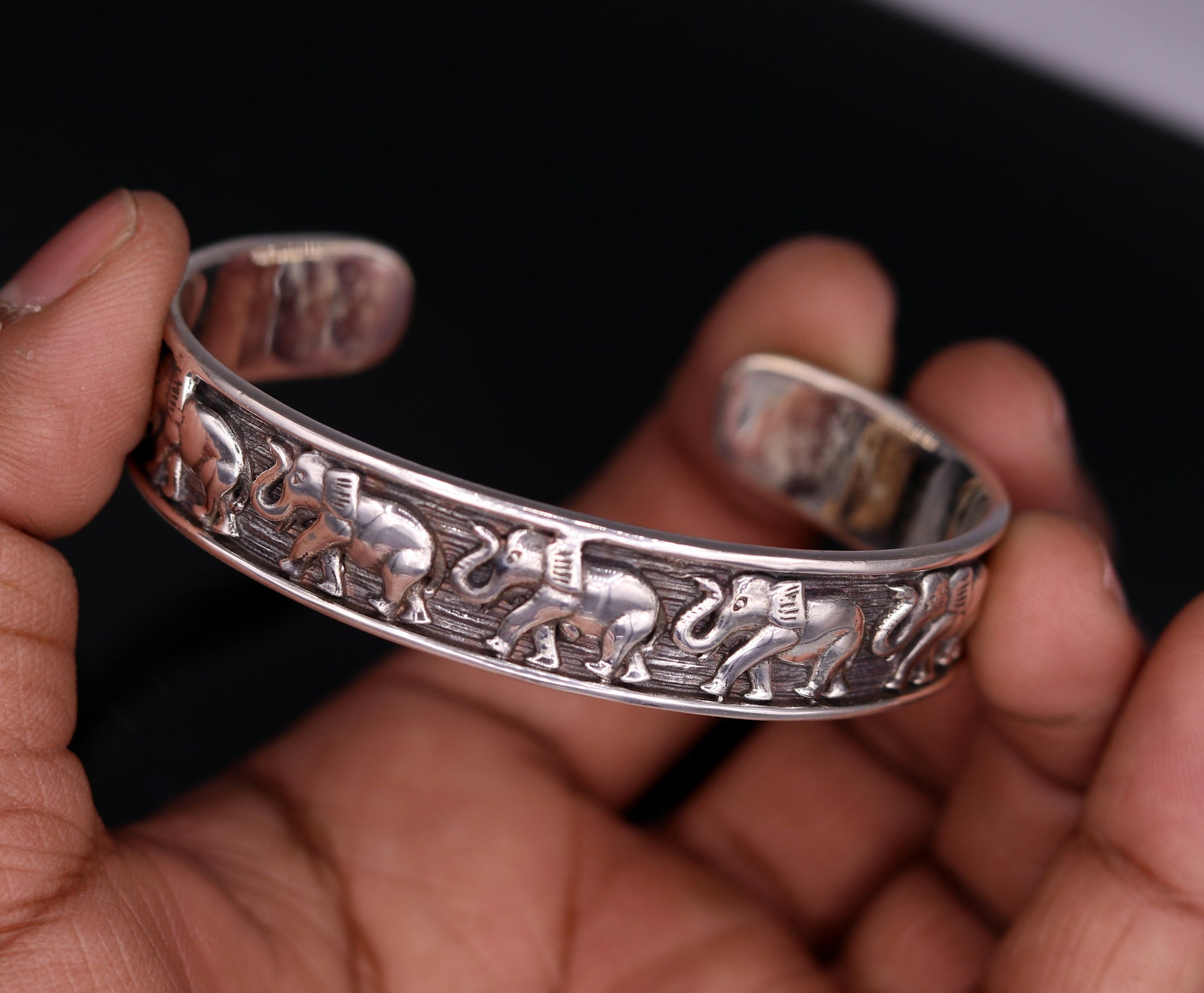 Sterling silver elephant design adjustable bangle cuff bracelet by Tribal Ornaments, unisex Indian jewelry with vintage antique style.