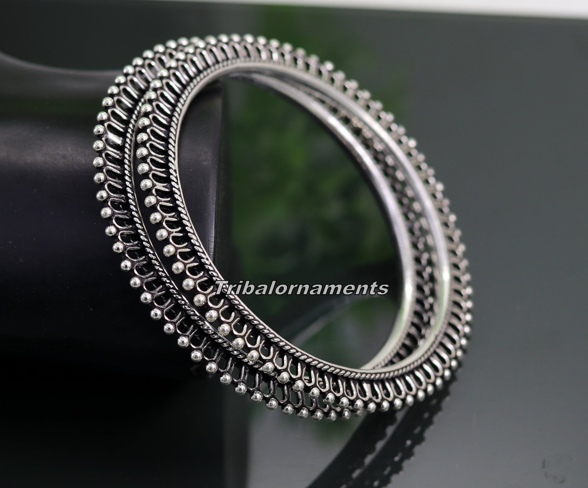 Vintage handmade 925 sterling silver bangle bracelet with oxidized tribal design, perfect for belly dance or tribal jewelry styles.