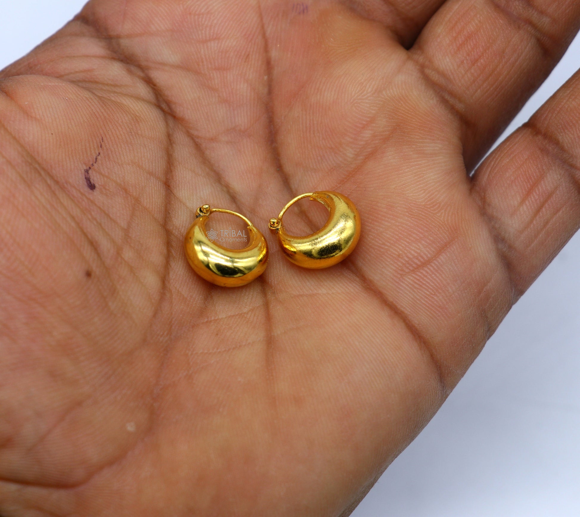 Vintage handmade sterling silver and gold polished boho hoop earrings featuring tribal Bali Banjara jewelry design.