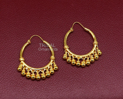 Handmade sterling silver boho hoop earrings with gold polish and bells, featuring tribal Banjara design and vintage antique style.