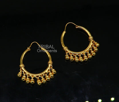 Vintage handmade 925 sterling silver boho hoop earrings with gold polish, bells, and tribal Banjara design from TRIBAL ORNAMENTS.