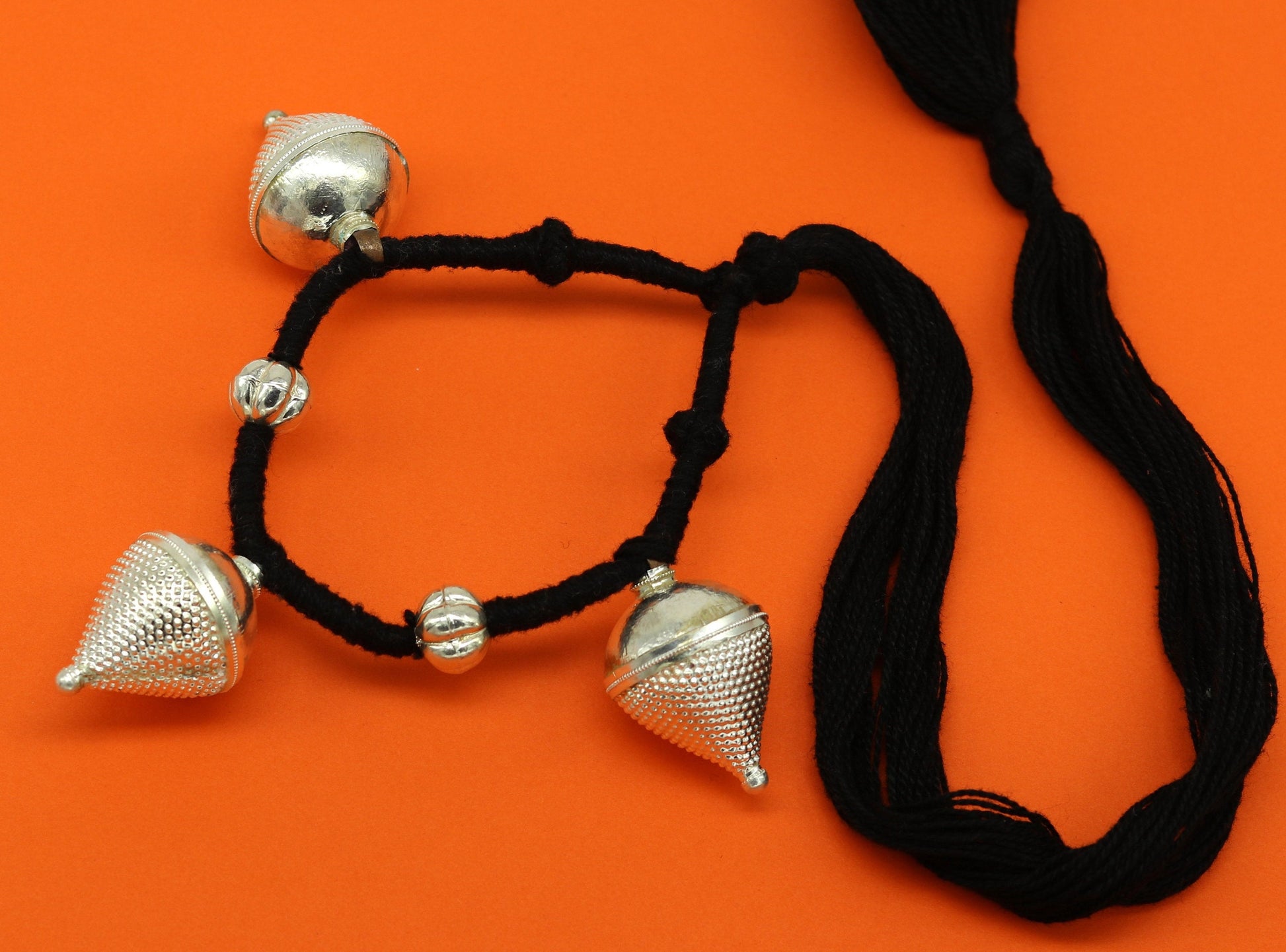 Vintage tribal charm necklace in sterling silver with intricate hand-crafted ethnic design, perfect for bridesmaids.