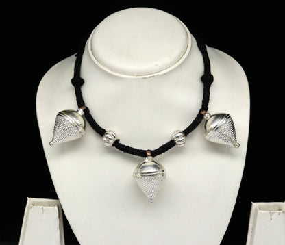 Vintage sterling silver tribal charm necklace with intricate handcrafted design, perfect for ethnic bridesmaids and special occasions.