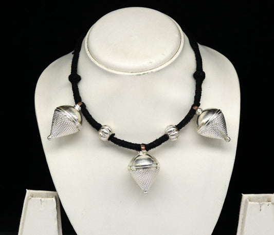 Vintage sterling silver tribal charm necklace with intricate handcrafted design, perfect for ethnic bridesmaids and special occasions.