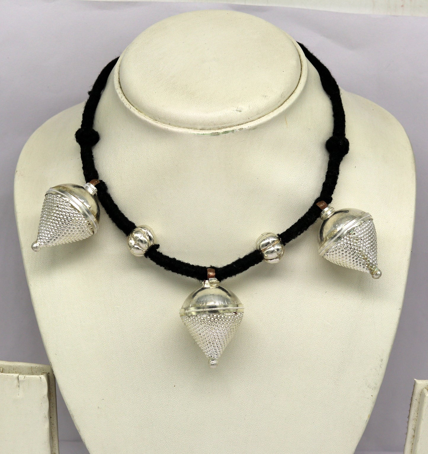 Vintage sterling silver tribal charm necklace with intricate handcrafted design, perfect for ethnic bridesmaid jewelry.