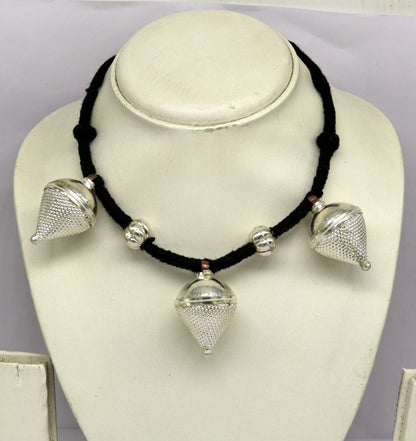 Vintage sterling silver tribal charm necklace with intricate handcrafted design, perfect for ethnic bridesmaid jewelry.