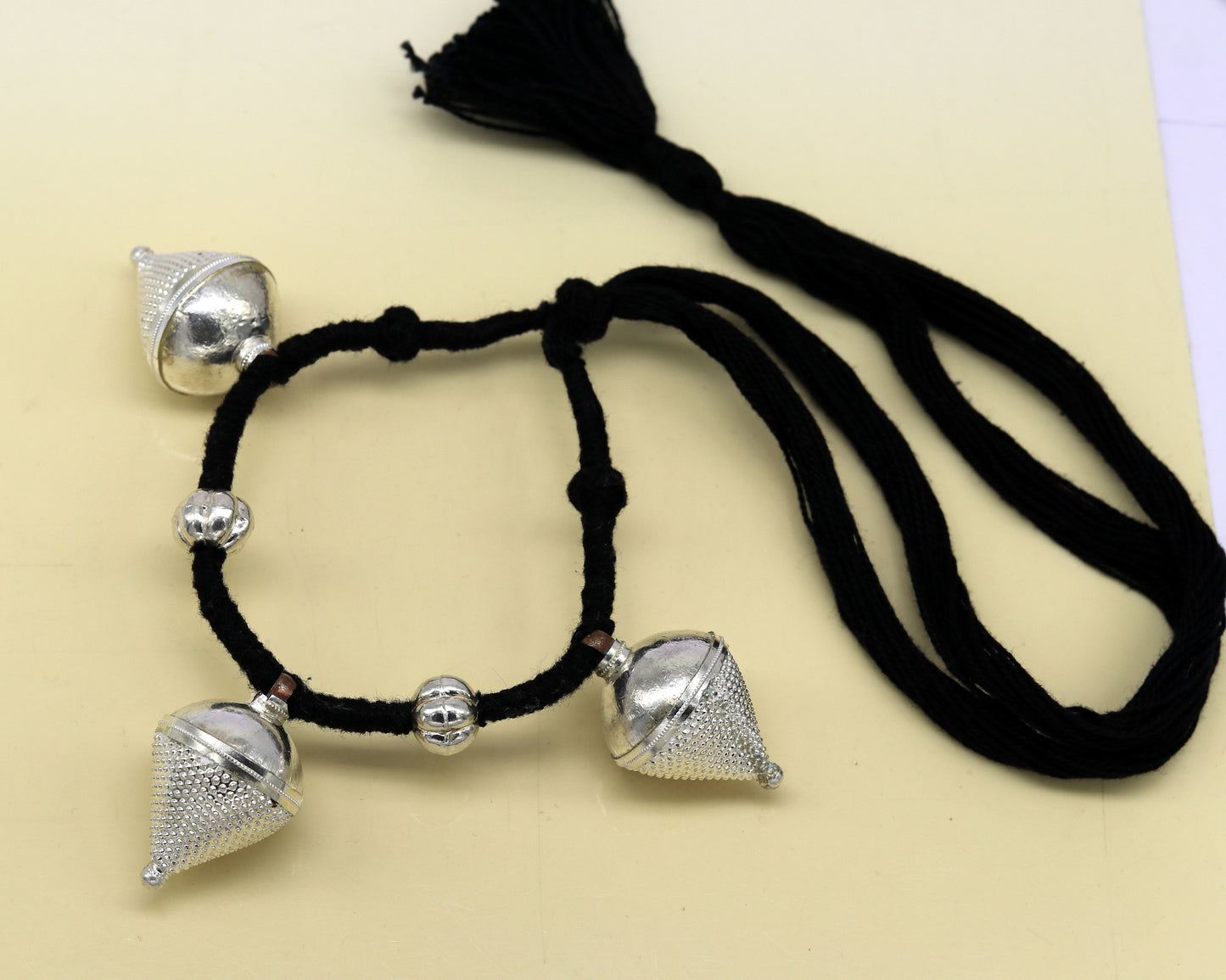 Vintage antique sterling silver tribal charm necklace with intricate ethnic design, handcrafted by TRIBAL ORNAMENTS.
