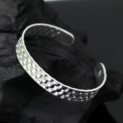 Vintage sterling silver open face adjustable bangle bracelet by Tribal Ornaments, unisex handcrafted jewelry with antique design.