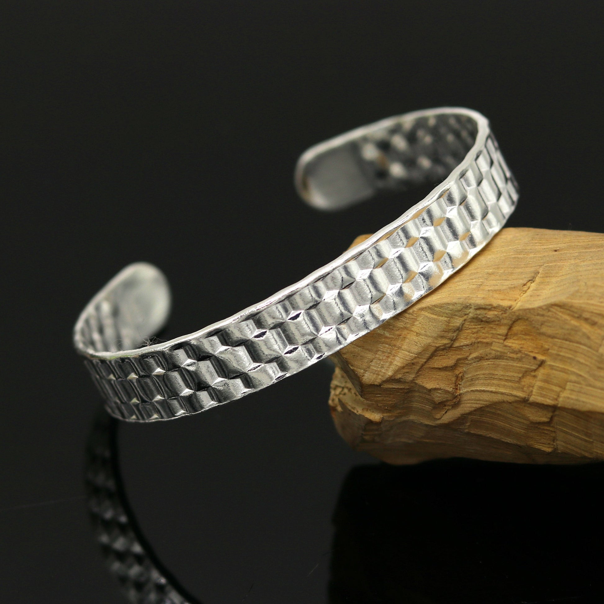 Vintage sterling silver open face adjustable bangle bracelet by Tribal Ornaments, unisex custom jewelry with intricate antique design.