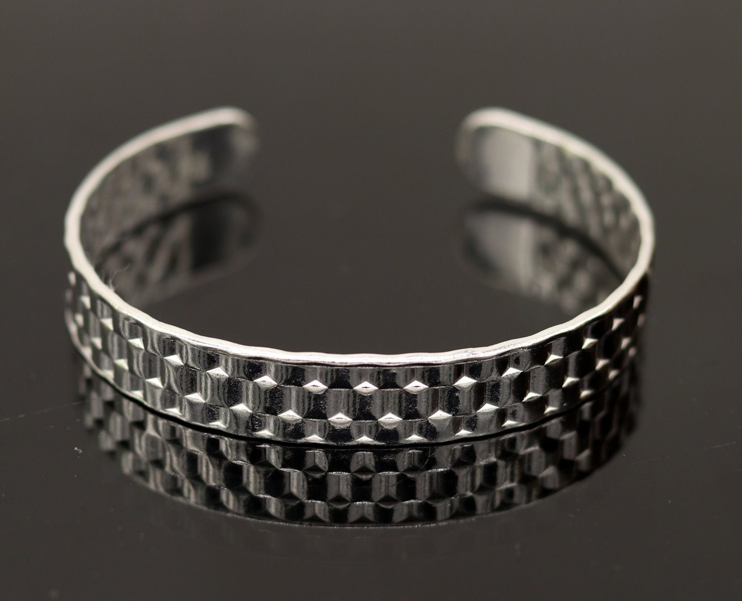 Vintage sterling silver open face adjustable bangle cuff bracelet by TRIBAL ORNAMENTS, unisex handcrafted jewelry with intricate antique design.