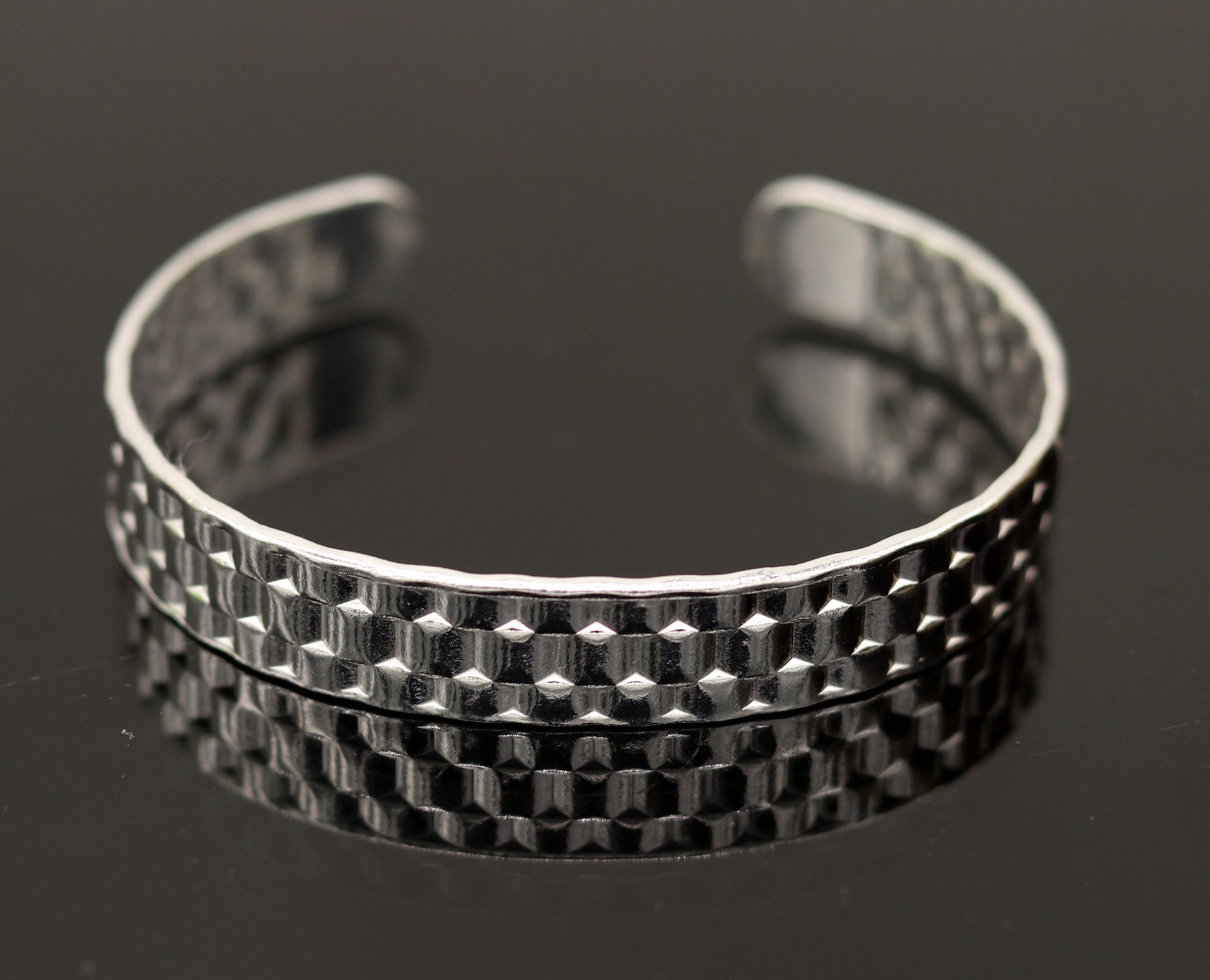 Vintage sterling silver open face adjustable bangle cuff bracelet by TRIBAL ORNAMENTS, unisex handcrafted jewelry with intricate antique design.