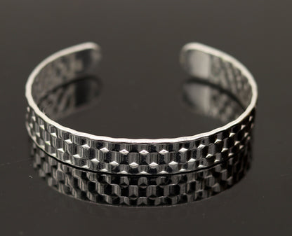 Vintage sterling silver open face adjustable bangle cuff bracelet by TRIBAL ORNAMENTS, unisex handcrafted jewelry with intricate antique design.
