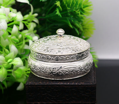 Vintage antique silver handmade trinket box with intricate tribal design, used as a God Prasad, Kumkum, or Sindur container.