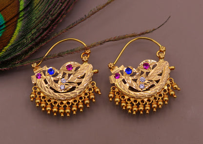 Vintage handmade 22K yellow gold tribal hoop earrings with hanging bells, traditional Indian jewelry featuring intricate tribal design.
