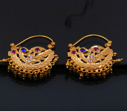 Vintage handmade 22K yellow gold tribal-style hoop earrings with hanging bells, traditional Indian jewelry design.