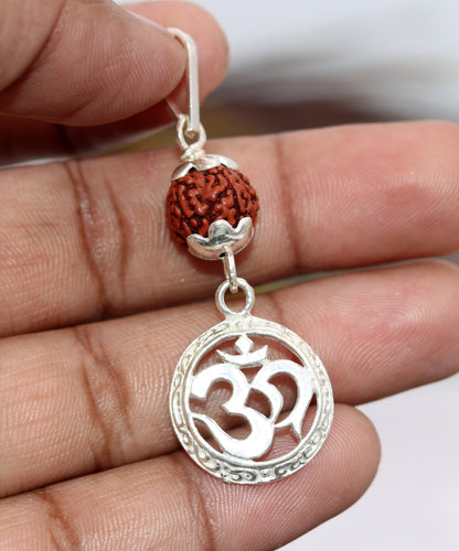 Vintage solid silver Aum pendant with natural Rudraksh beads, handcrafted tribal jewelry featuring religious symbols.