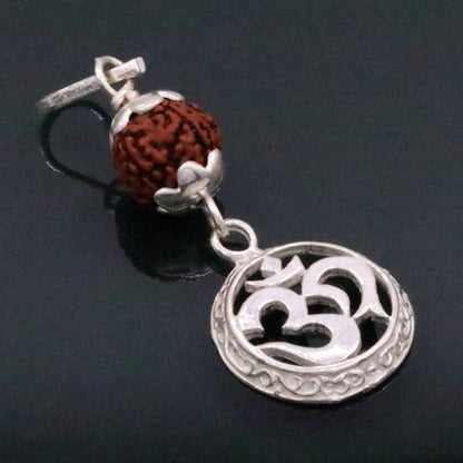 Vintage solid silver Aum pendant with natural Rudraksh beads, handmade tribal jewelry, intricate pendant design.