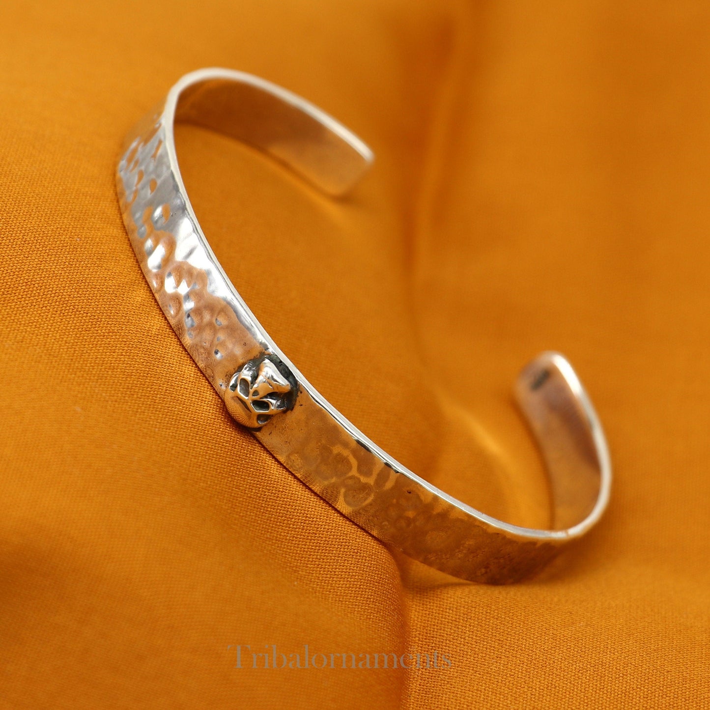 Vintage style 925 sterling silver adjustable cuff bangle bracelet by Tribal Ornaments with skull design, unisex jewelry.