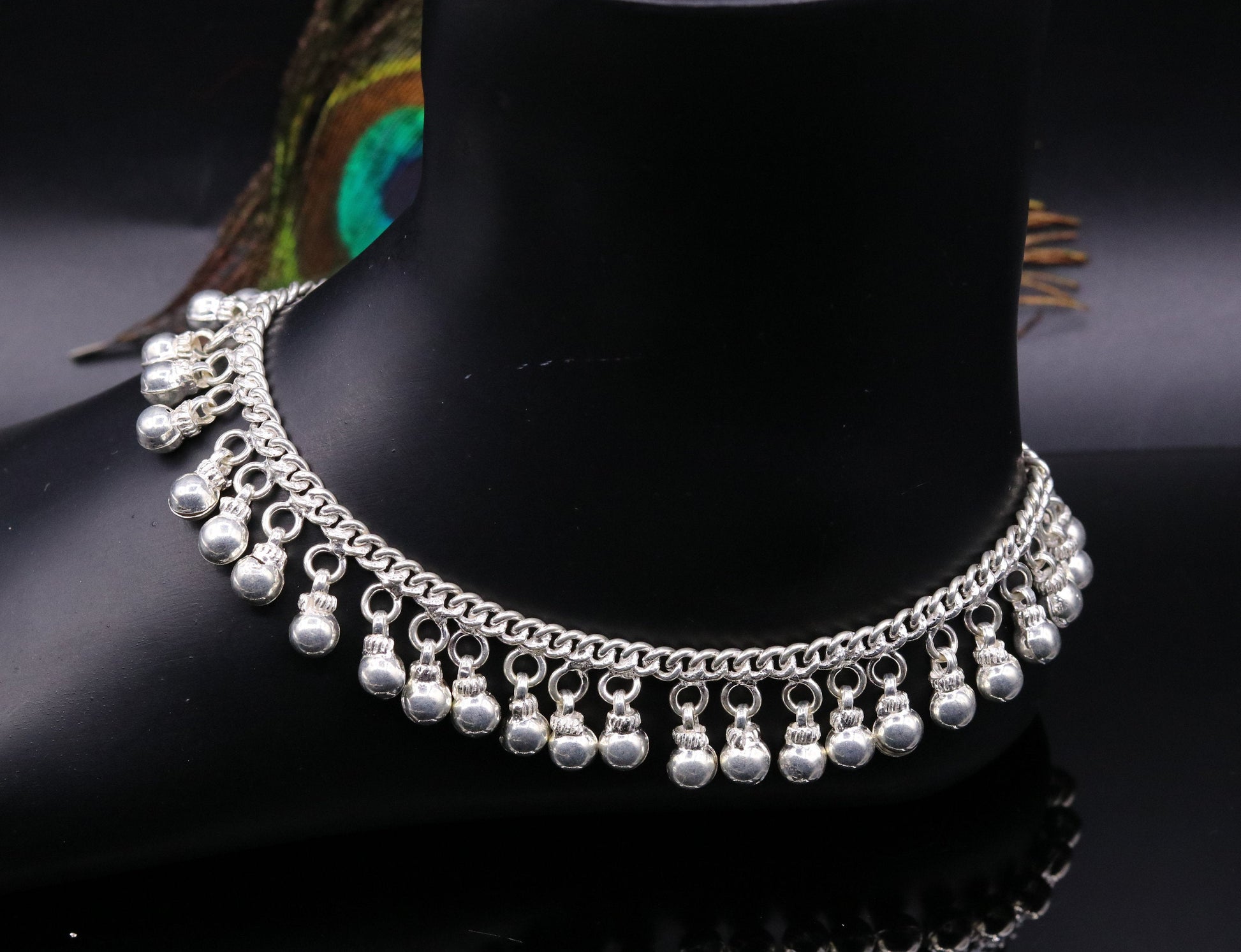 Vintage sterling silver ankle bracelet with handmade chain and noisy jingle bells, featuring tribal design and genuine jewelry craftsmanship.