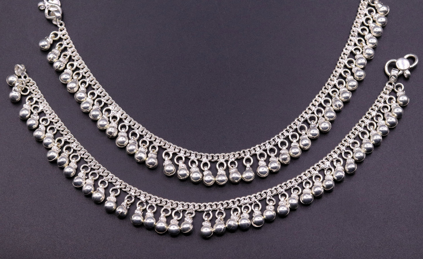 Vintage sterling silver ankle bracelet with handmade chain and jingle bells, featuring tribal-inspired design and genuine jewelry craftsmanship.