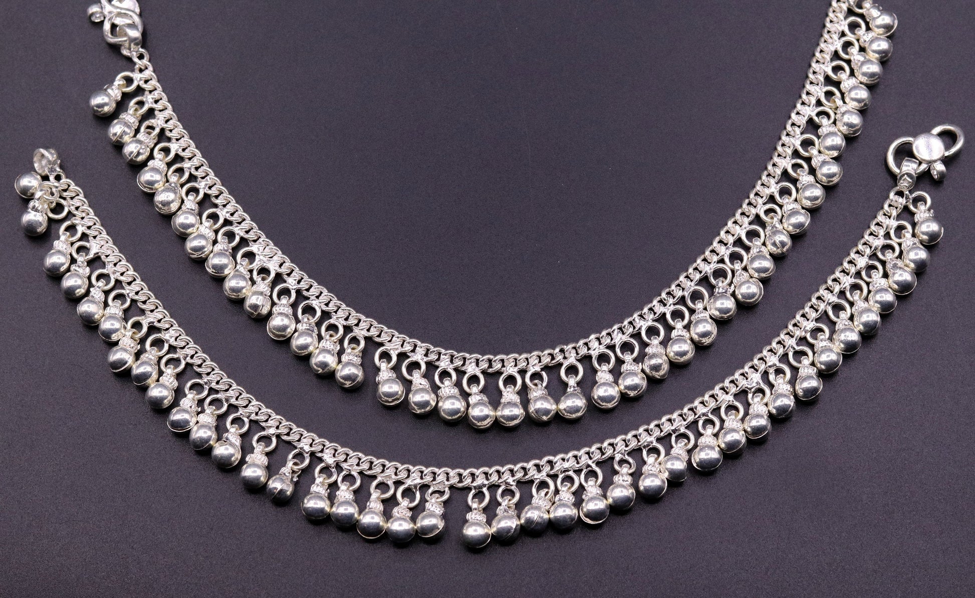 Vintage sterling silver ankle bracelet with handmade chain and jingle bells, featuring tribal-inspired design and genuine jewelry craftsmanship.