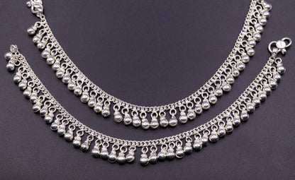 Vintage sterling silver ankle bracelet with handmade chain and jingle bells, featuring tribal-inspired design and genuine jewelry craftsmanship.