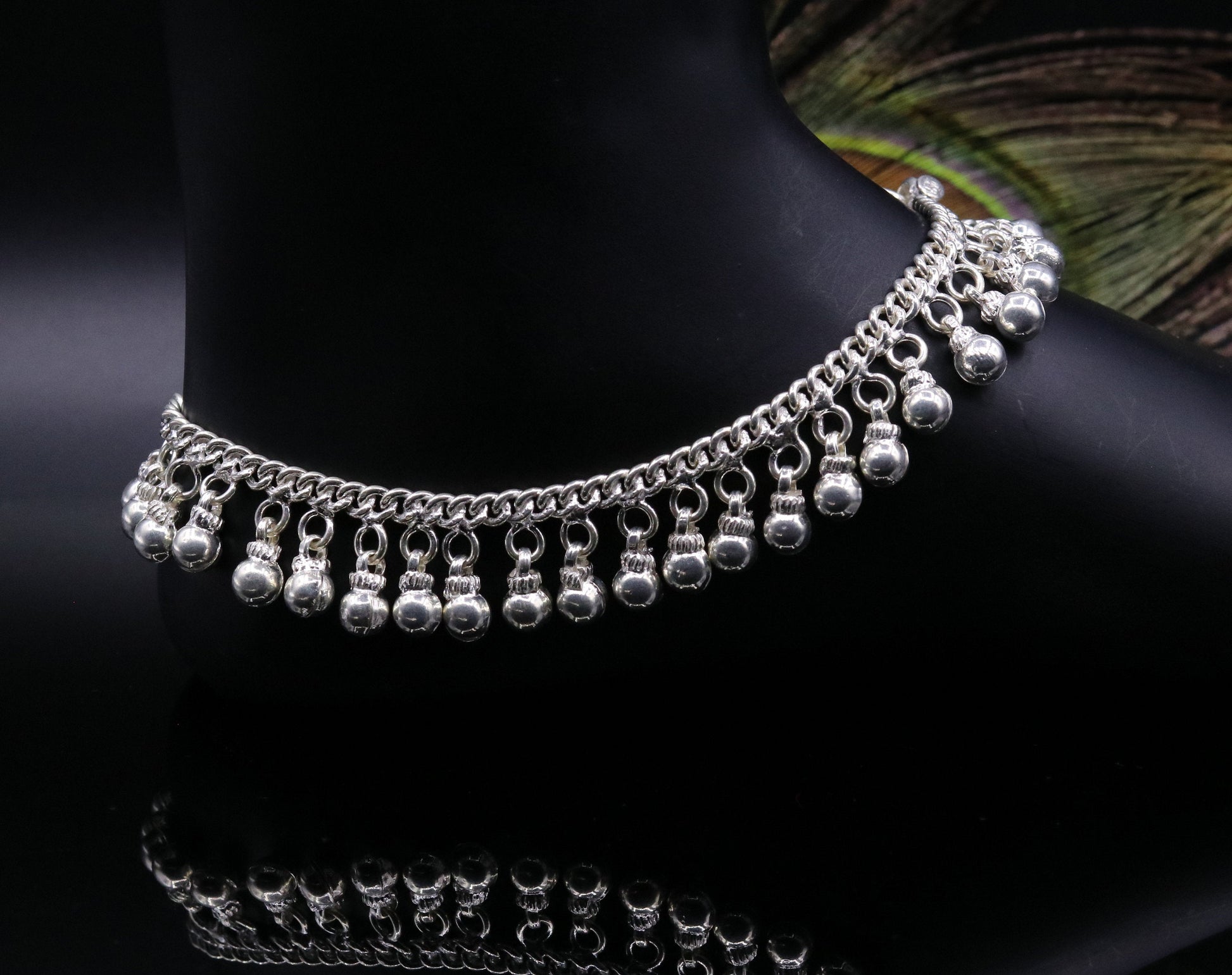 Vintage sterling silver ankle bracelet with handmade solid chain and noisy jingle bells, featuring genuine jewelry craftsmanship.