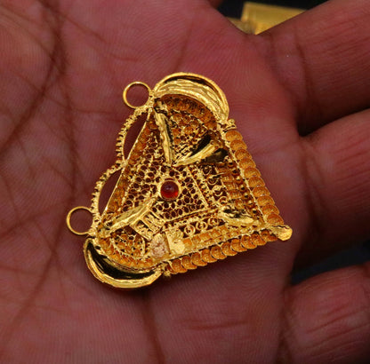 Vintage 22KT yellow gold filigree Meenakari pendant with intricate tribal design, part of traditional Indian tribal jewelry.