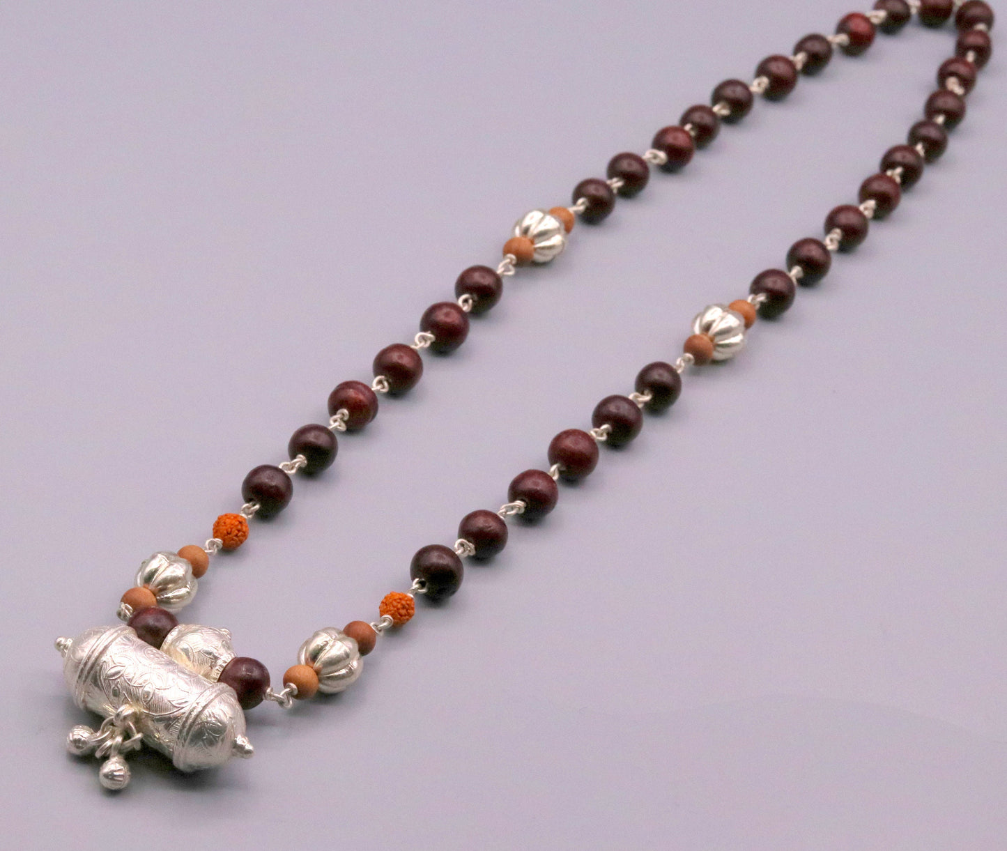 Vintage tribal necklace set with solid silver sandalwood, rudraksha beads, and hanging bell amulet pendant from TRIBAL ORNAMENTS