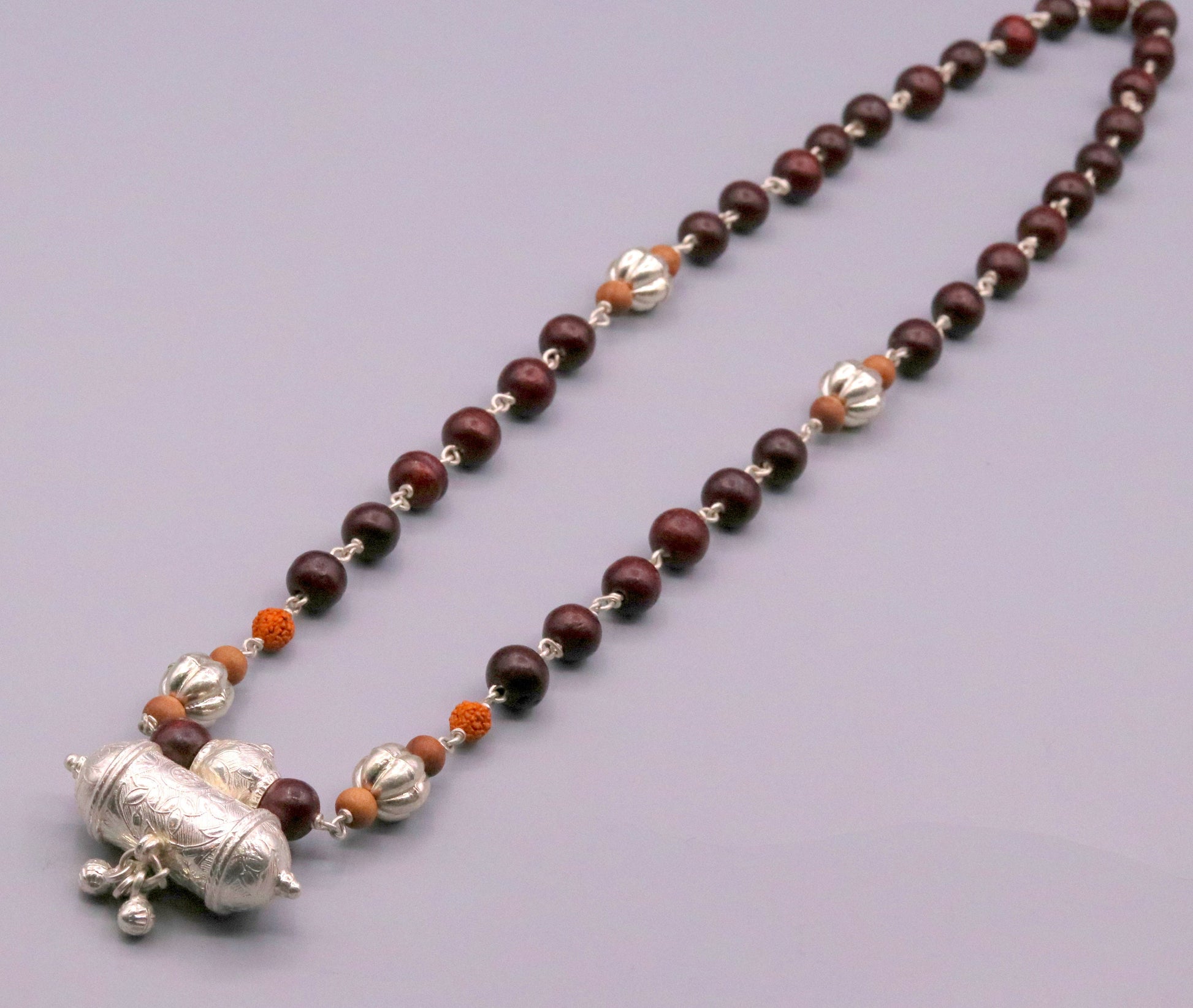Vintage tribal necklace set with solid silver sandalwood, rudraksha beads, and hanging bell amulet pendant from TRIBAL ORNAMENTS