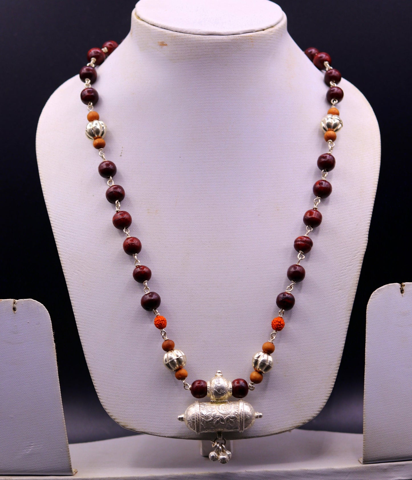 Vintage tribal silver necklace set with sandalwood, Rudraksha beads, amulet pendant, and hanging bells by TRIBAL ORNAMENTS.