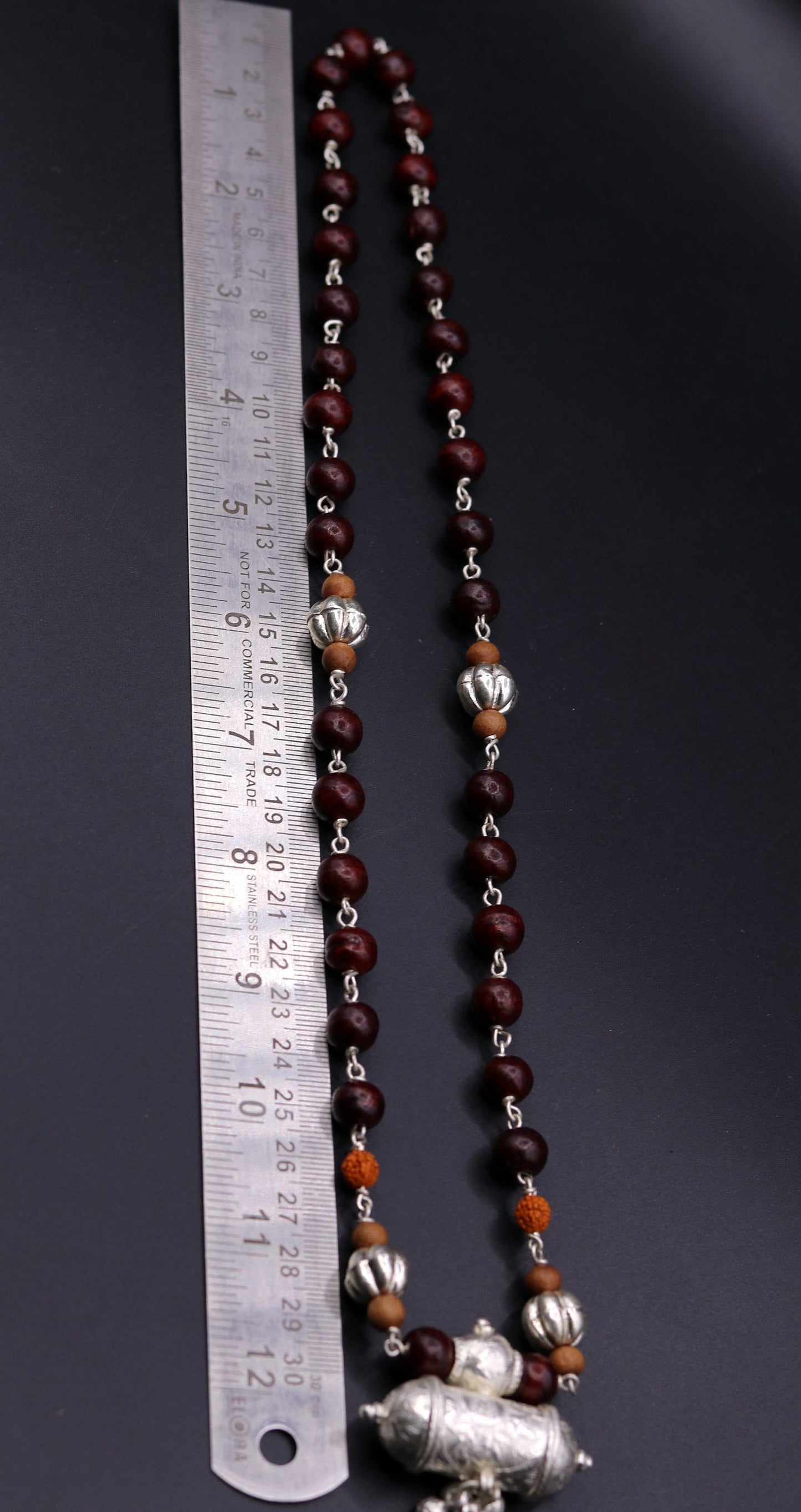 Vintage tribal jewelry set with solid silver sandalwood and Rudraksha bead amulet pendant with hanging bells, from TRIBAL ORNAMENTS.