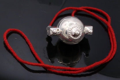 Vintage solid silver Lord Shiva Lingam box pendant with tribal design, used as an amulet or mantra jewelry container.