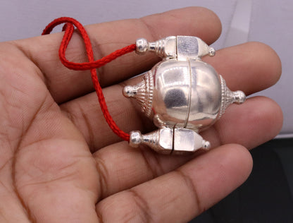 Vintage tribal silver Shiva Lingam box pendant with intricate designs, used as an amulet, prayer, or mantra jewelry.