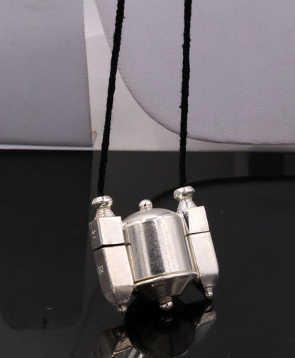 Vintage silver Shiva Lingam box and amulet pendant, handcrafted tribal jewelry from India with intricate tribal design.