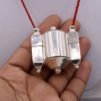 Vintage silver Shiva Lingam pendant and prayer box, tribal jewelry with intricate Indian tribal design from Rajasthan.