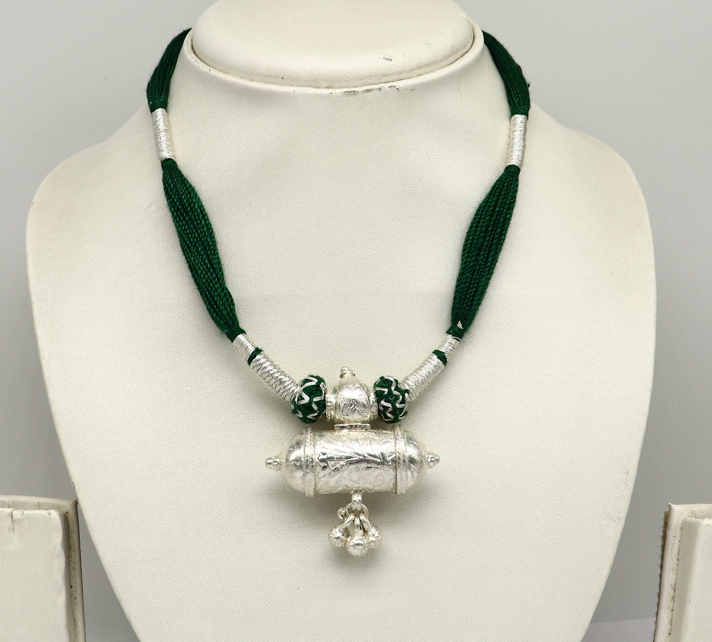 Vintage Indian silver charm necklace with green thread, traditional tribal wedding jewelry, ethnic design by TRIBAL ORNAMENTS.