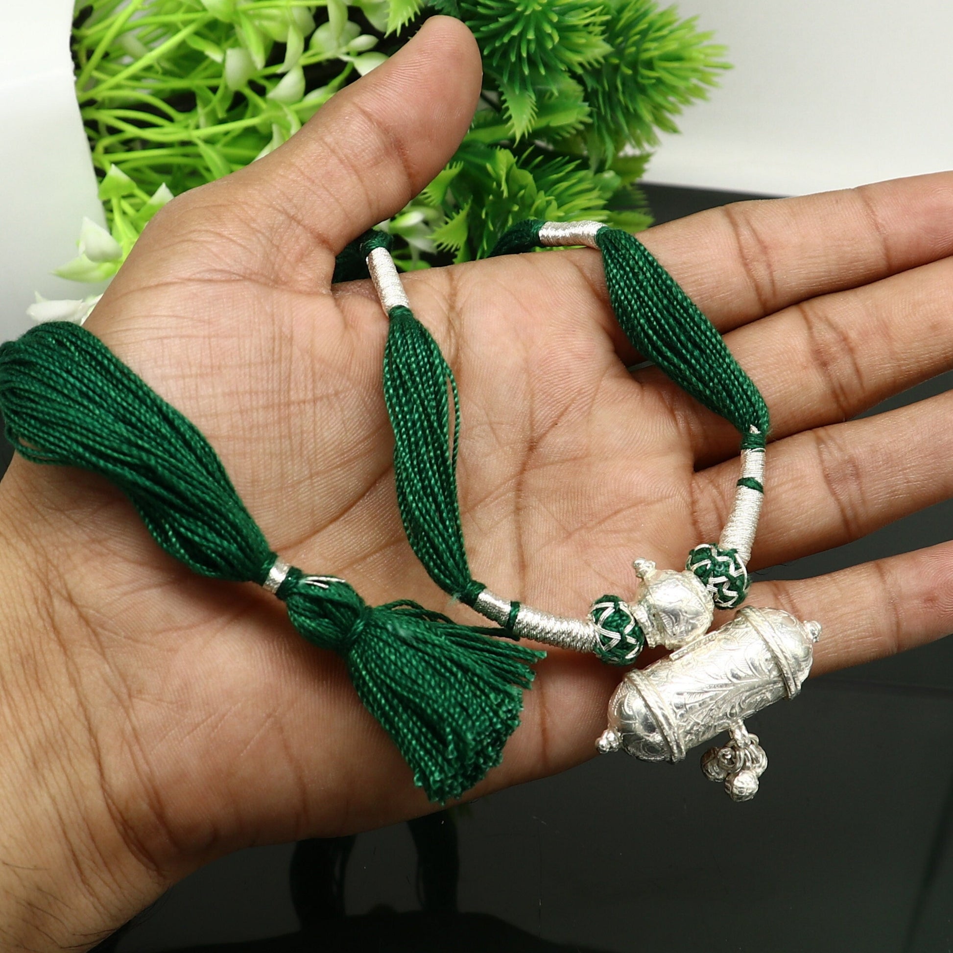 Vintage Indian tribal silver charm necklace with green thread, traditional bridal jewelry set by Tribal Ornaments.