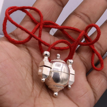 Vintage silver Shiva pendant box from Tribal Ornaments, handcrafted tribal jewelry amulet container with intricate design.