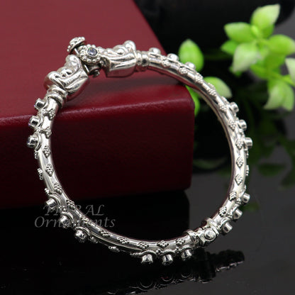 Sterling silver Elephant face bangle bracelet by TRIBAL ORNAMENTS, unisex, handmade with shiny vintage design on polished silver.