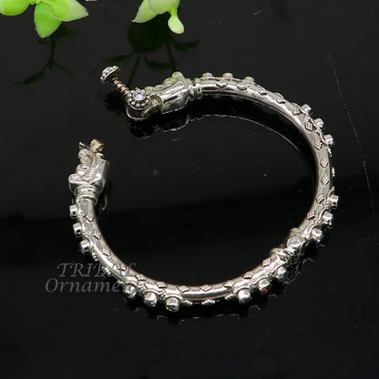 Sterling silver elephant face bangle bracelet by TRIBAL ORNAMENTS, unisex handmade jewelry with shiny, vintage design.
