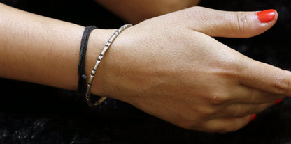 Vintage solid silver tribal bangle bracelet with traditional handcrafted design, showcasing ethnic and ethnic jewelry style.