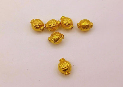 Handmade vintage-style jewelry beads with engraved traditional tribal designs, perfect for unique jewelry making projects.