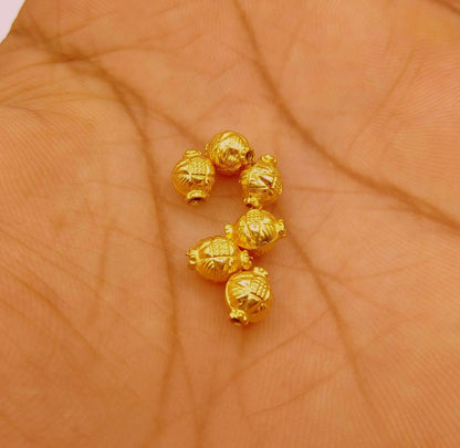 Handmade vintage-style beads with engraved designs, traditional jewelry-making beads by TRIBAL ORNAMENTS.